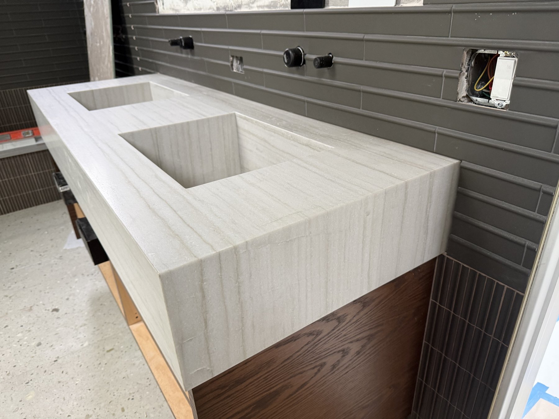 Thick light stone bathroom top with two integrated rectangular basins