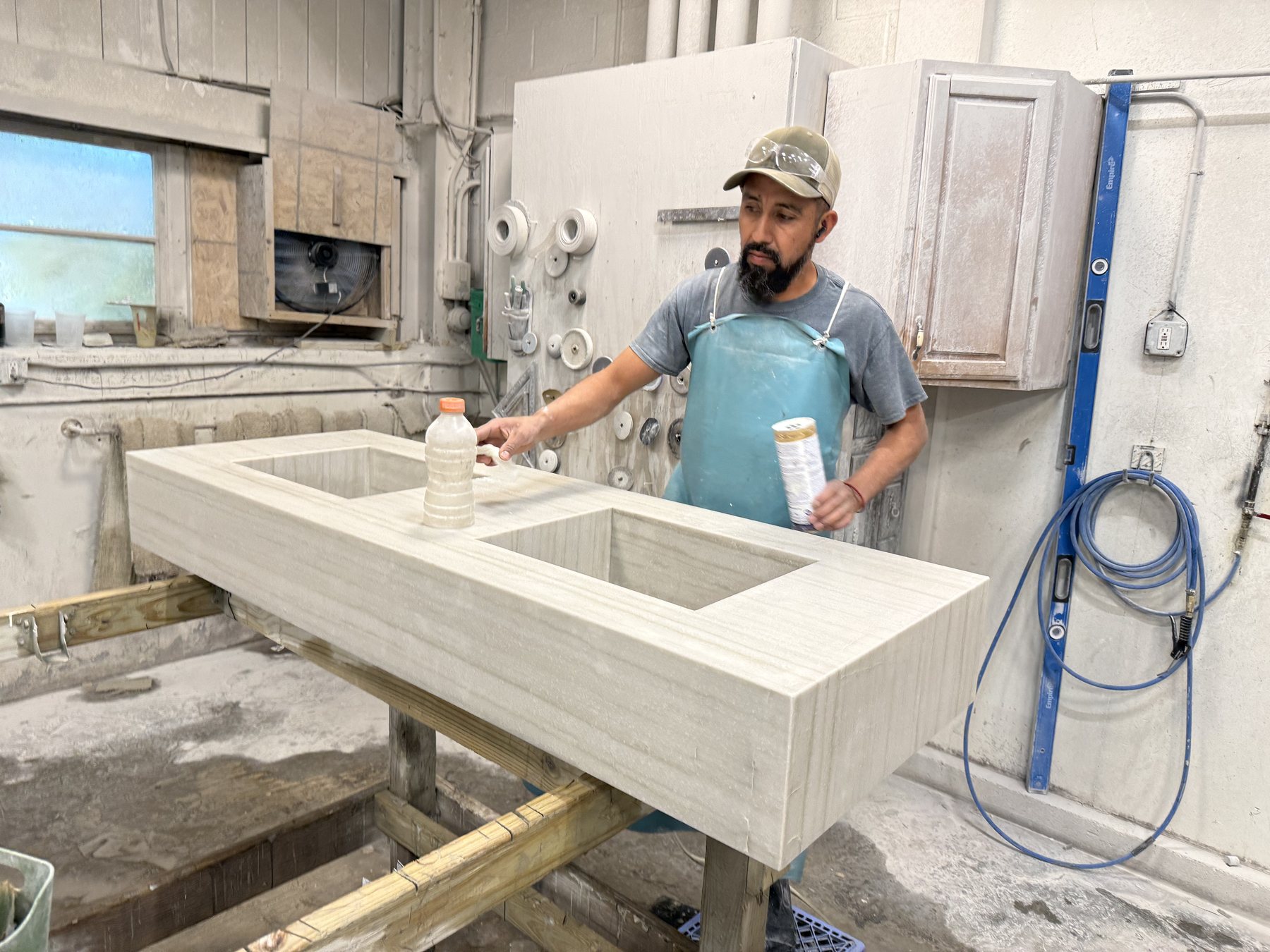 STONELUX fabricator working on a custom integrated stone sink
